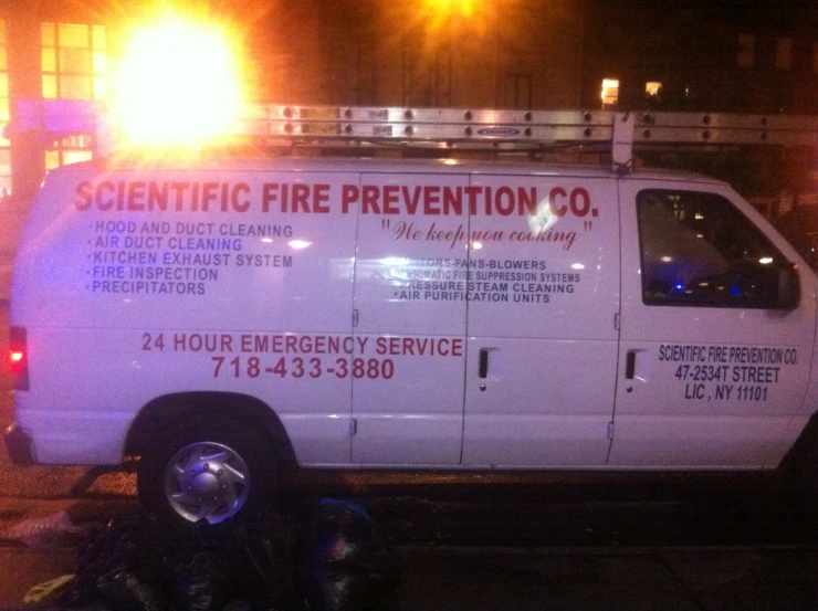 a white fire department truck parked in a parking lot