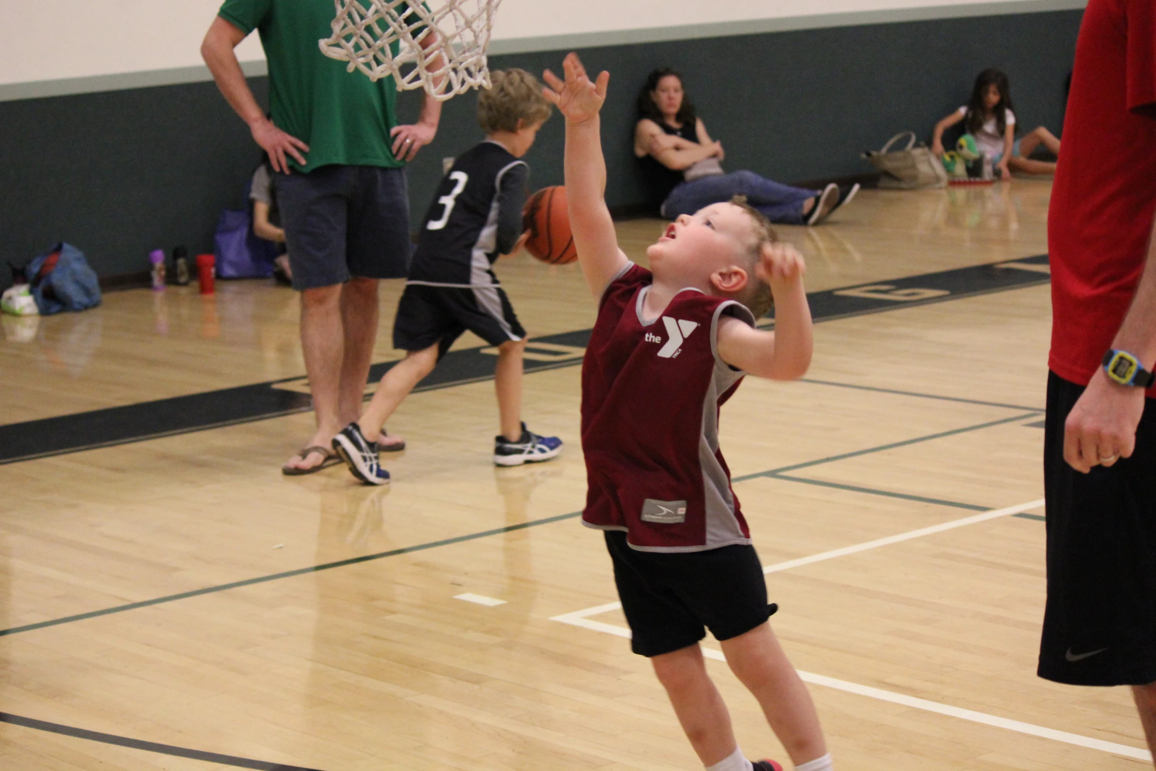 a  playing basketball and getting ready to pass the ball