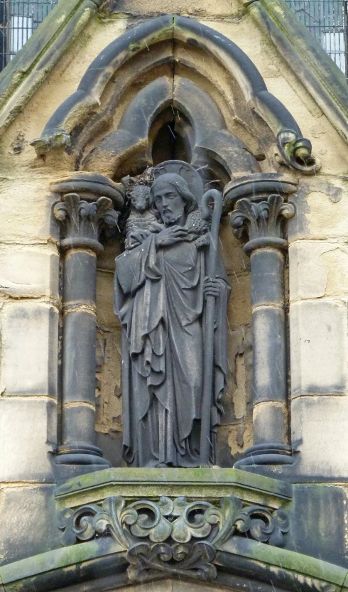 a statue of jesus and mary in a medieval style building