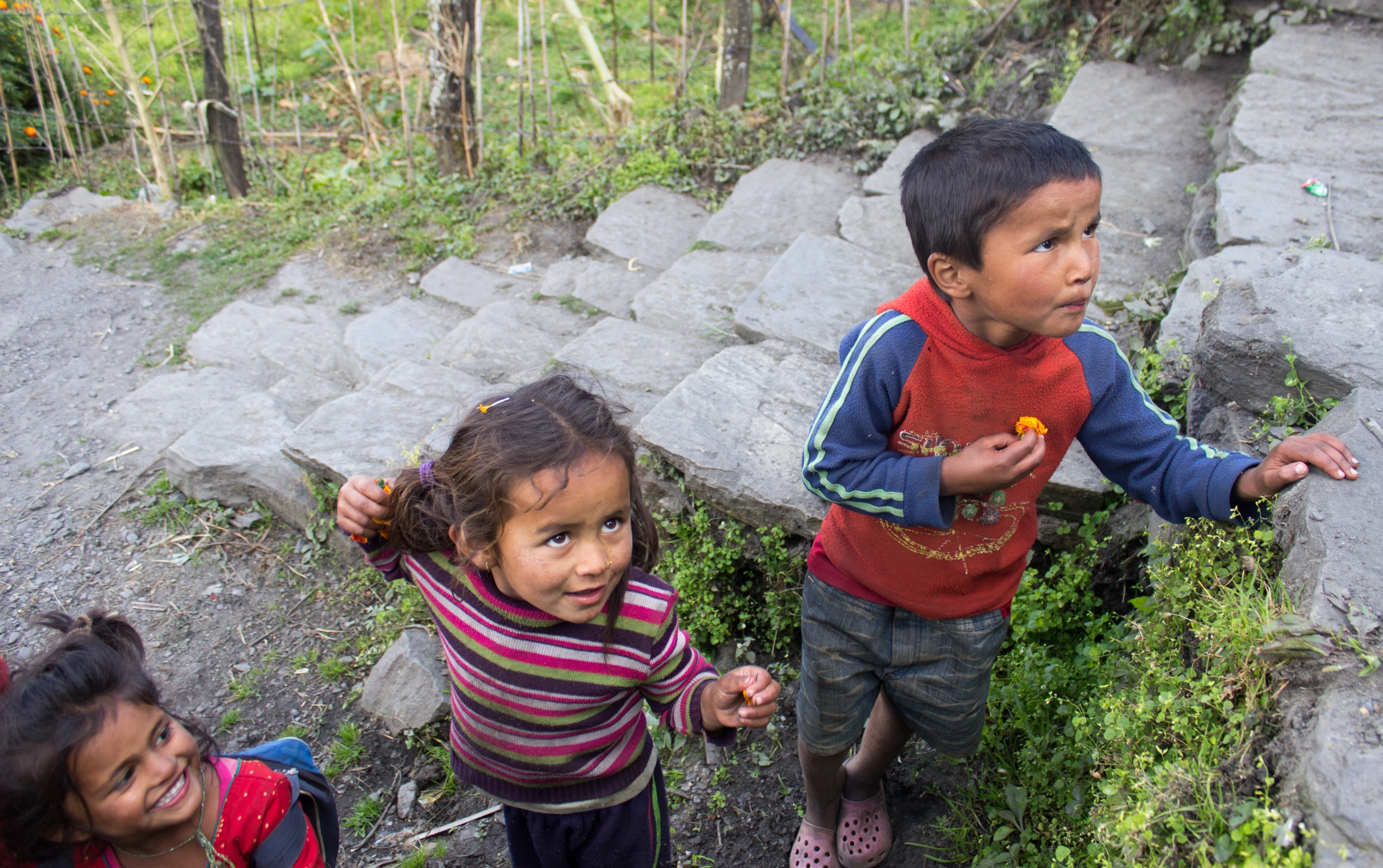 a group of young children standing next to each other