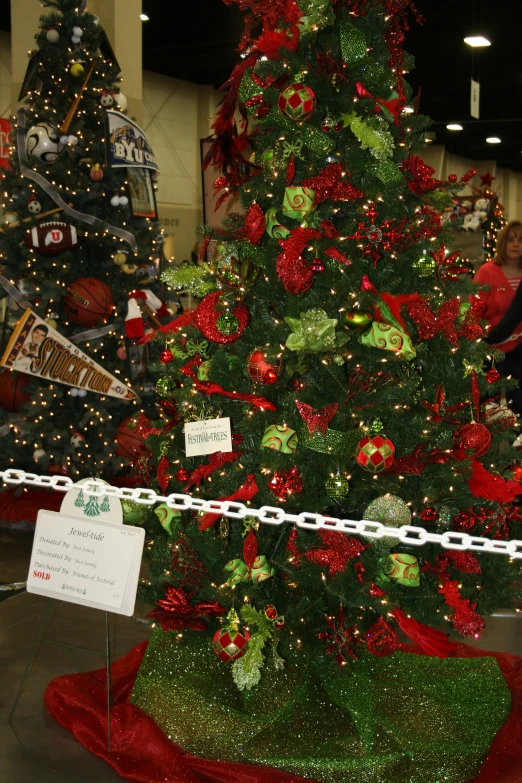 a brightly decorated christmas tree with decorations