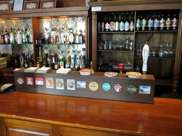 an image of a bar with shelves of various types of bottles