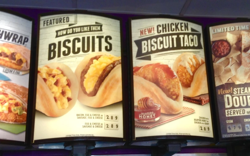 three advertising board on a restaurant wall display of biscuits