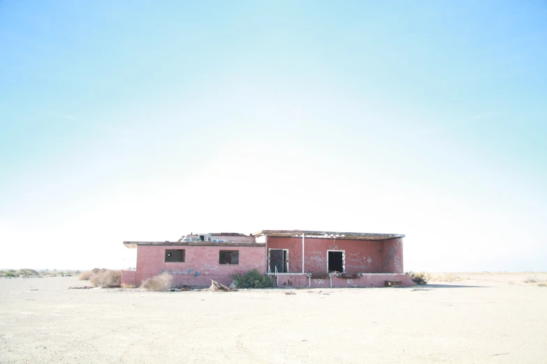 an old adobe building in the middle of nowhere