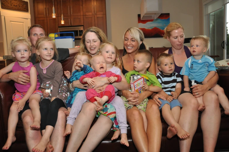 a large family is posing for a po together