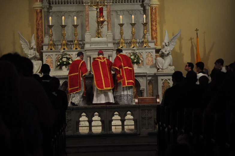 the priest is leading his congregation during a mass