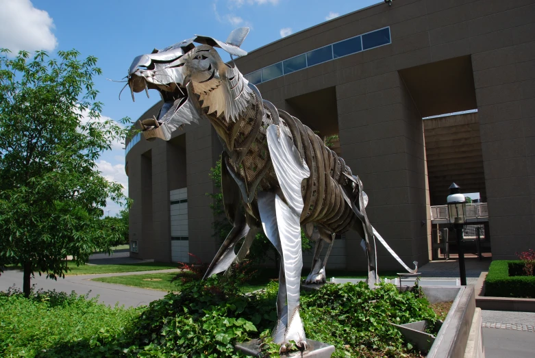 a sculpture of a dog outside a building