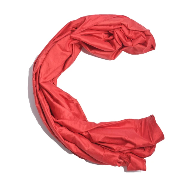 a red scarf is laid on the floor