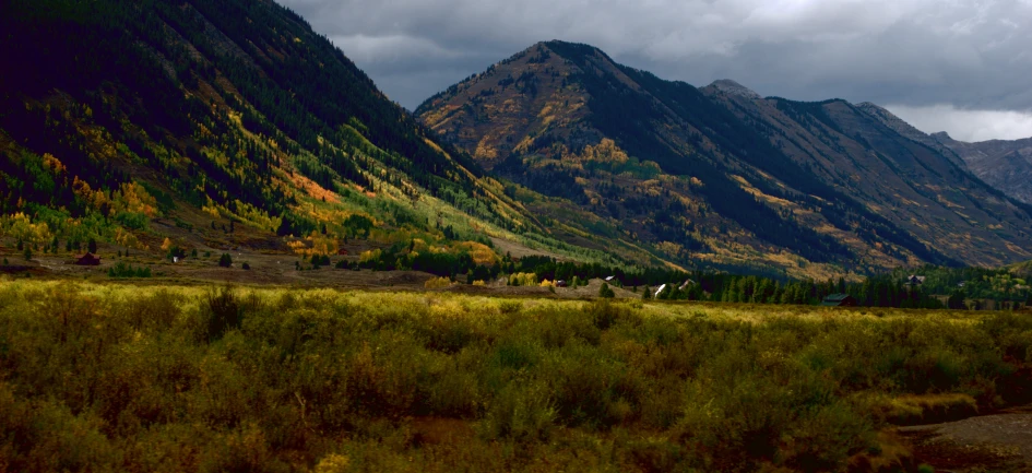 a beautiful, scenic mountain valley with rolling clouds