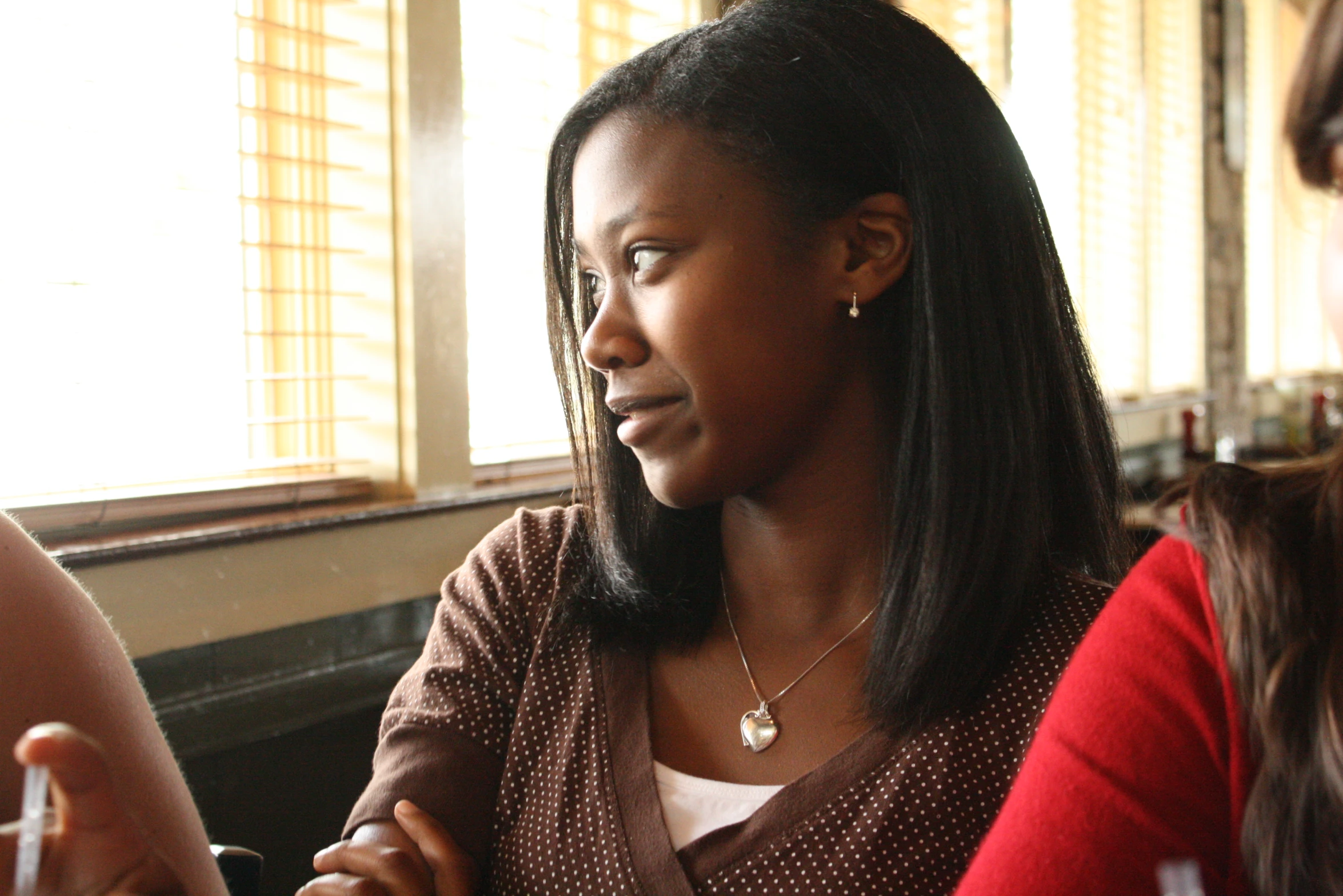 women seated eating food in a restaurant