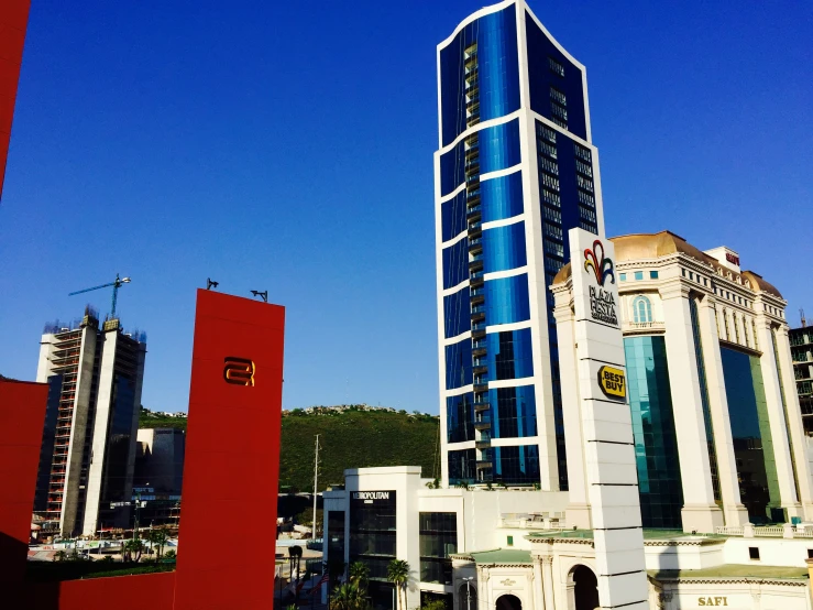 tall buildings sitting beside each other on a sunny day