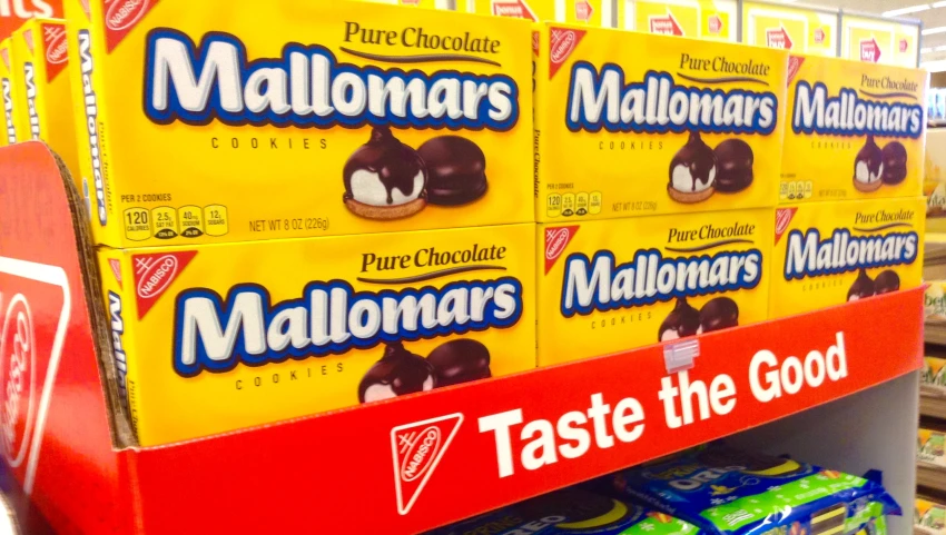 a store shelf in a store with many packages on it