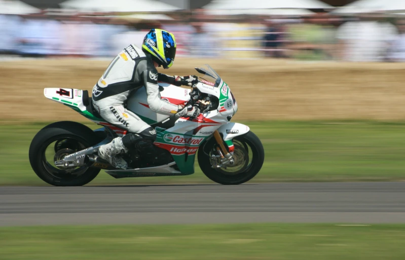 a person is riding on a motorcycle down the road