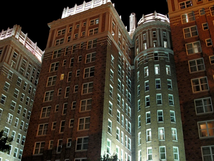 a group of large buildings next to each other at night