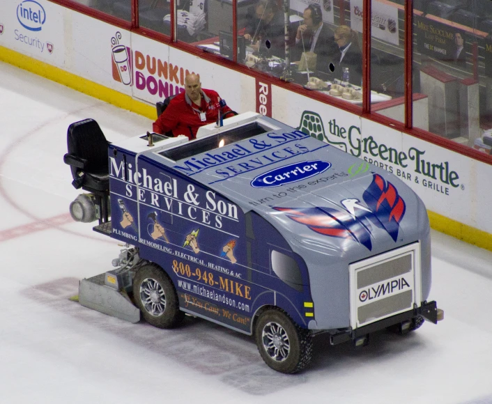 a large ice hockey bus parked near an arena