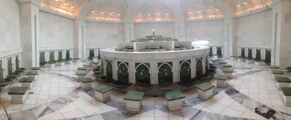 the circular room in the large mosque features a round fountain with columns and windows