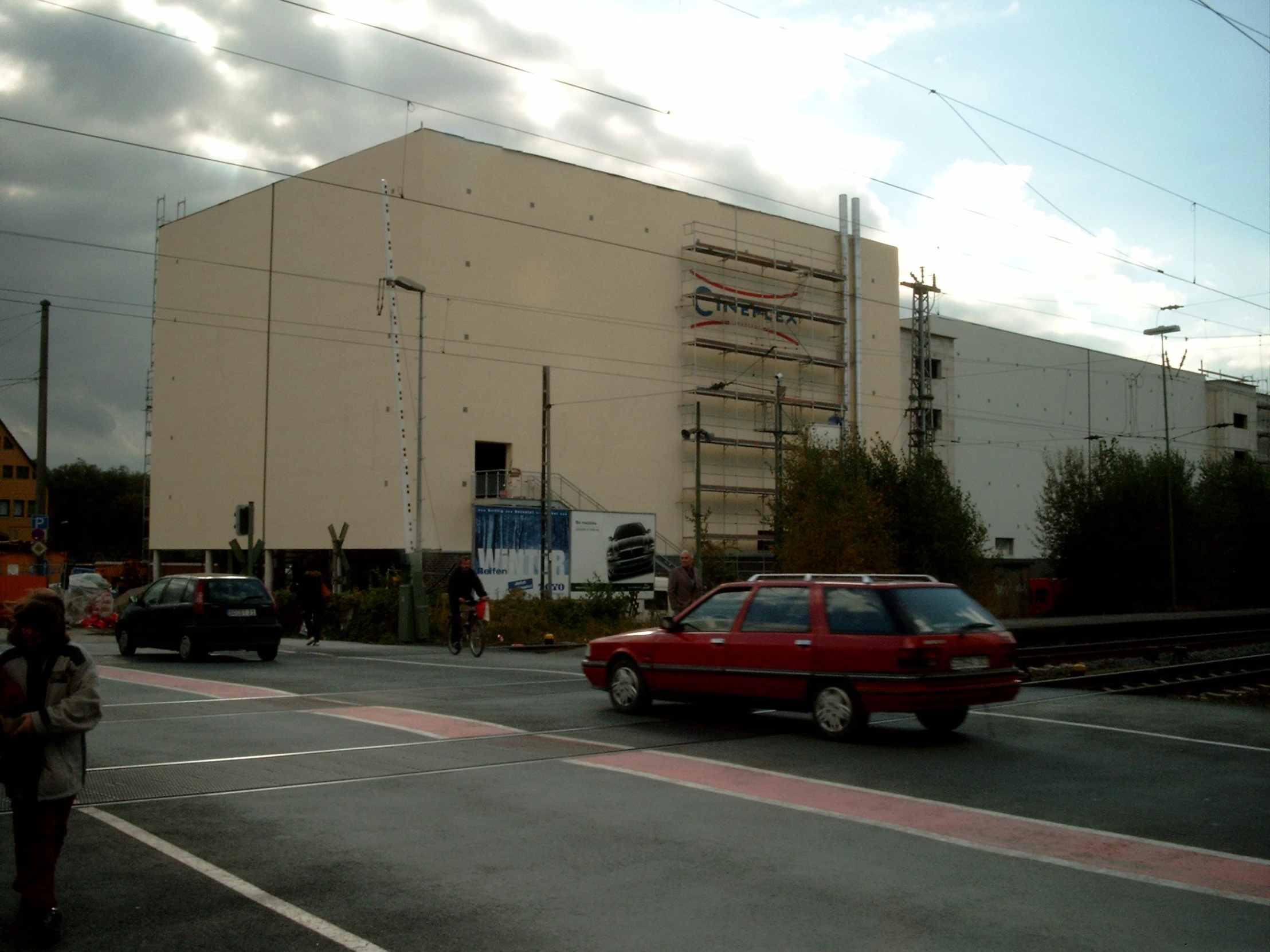 a large building with many wires above it's roof