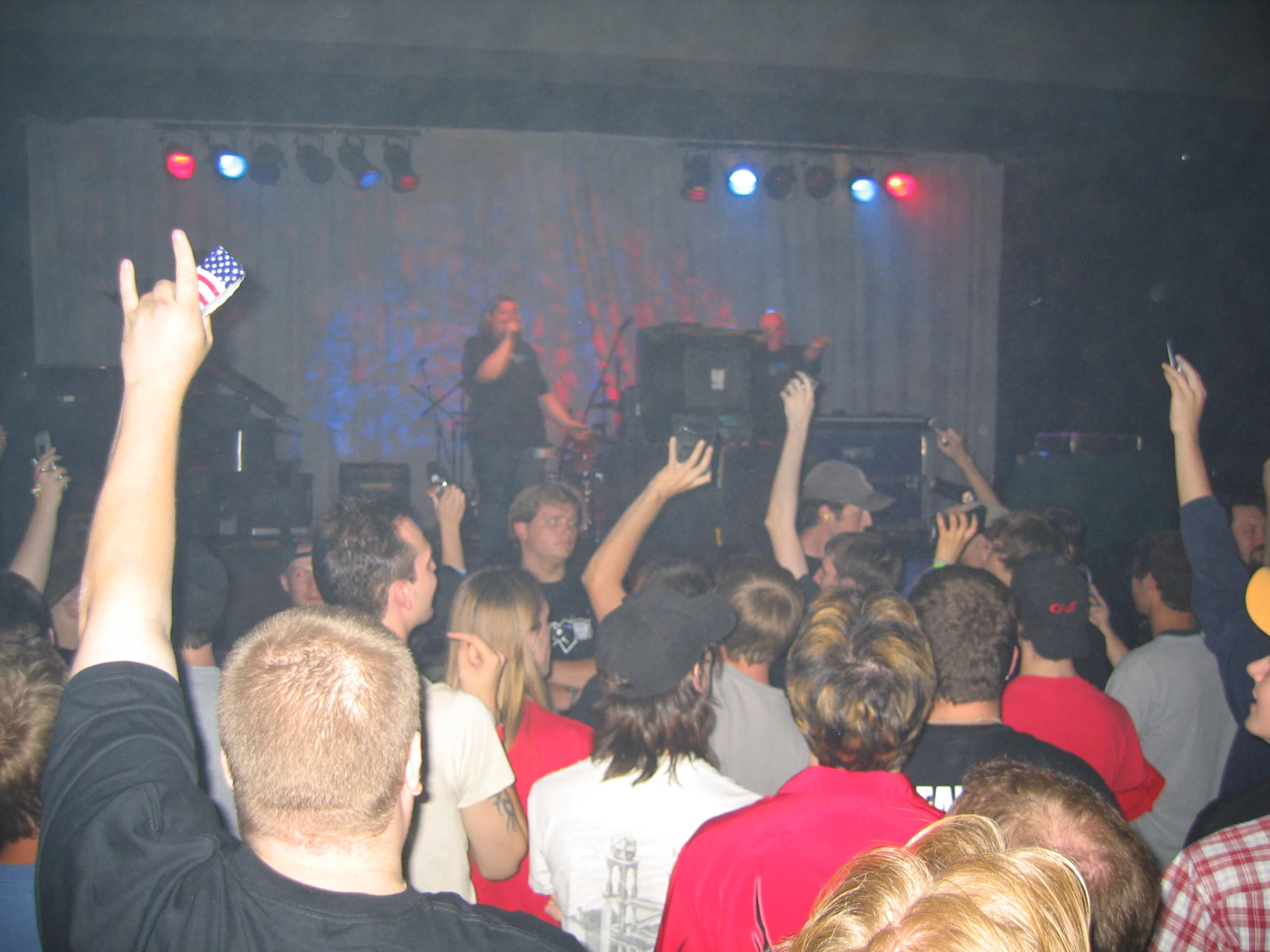 a group of people standing around at a concert