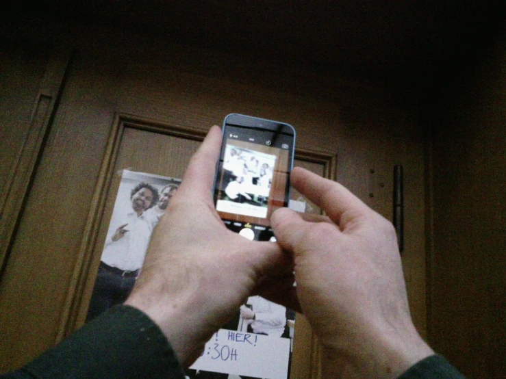 an image of someone holding their cell phone