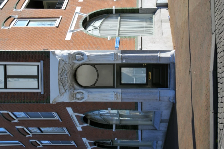 a red brick building with a clock above it