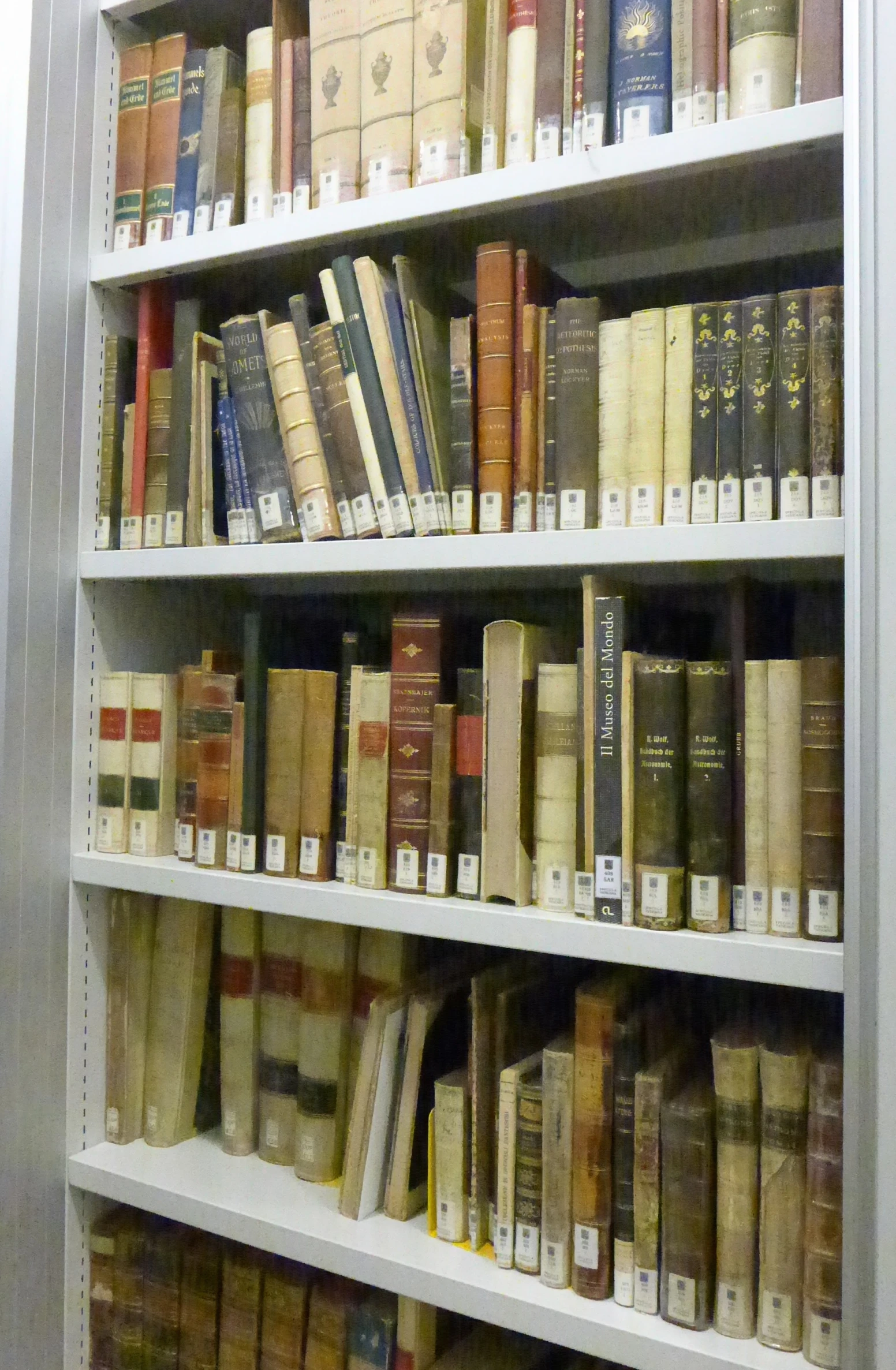 a book shelf full of books and other items