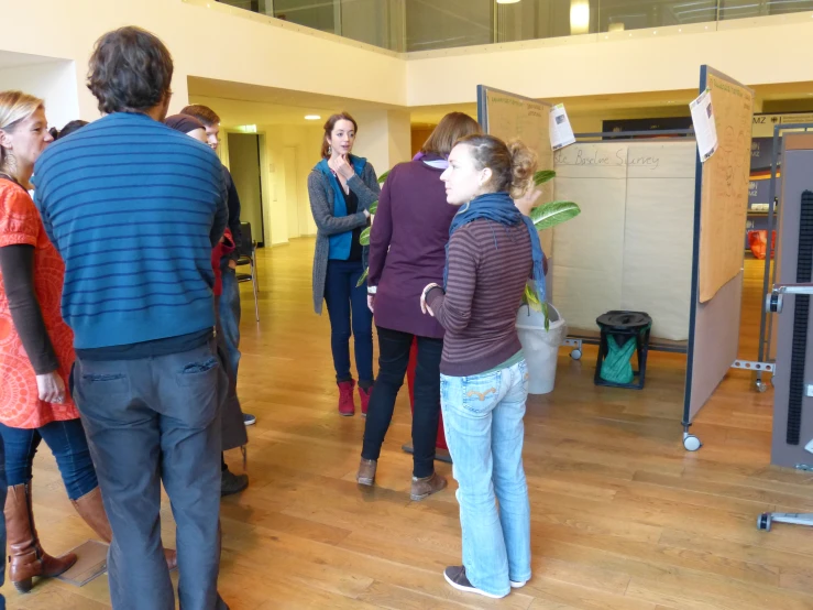 a group of people standing in front of a projector screen