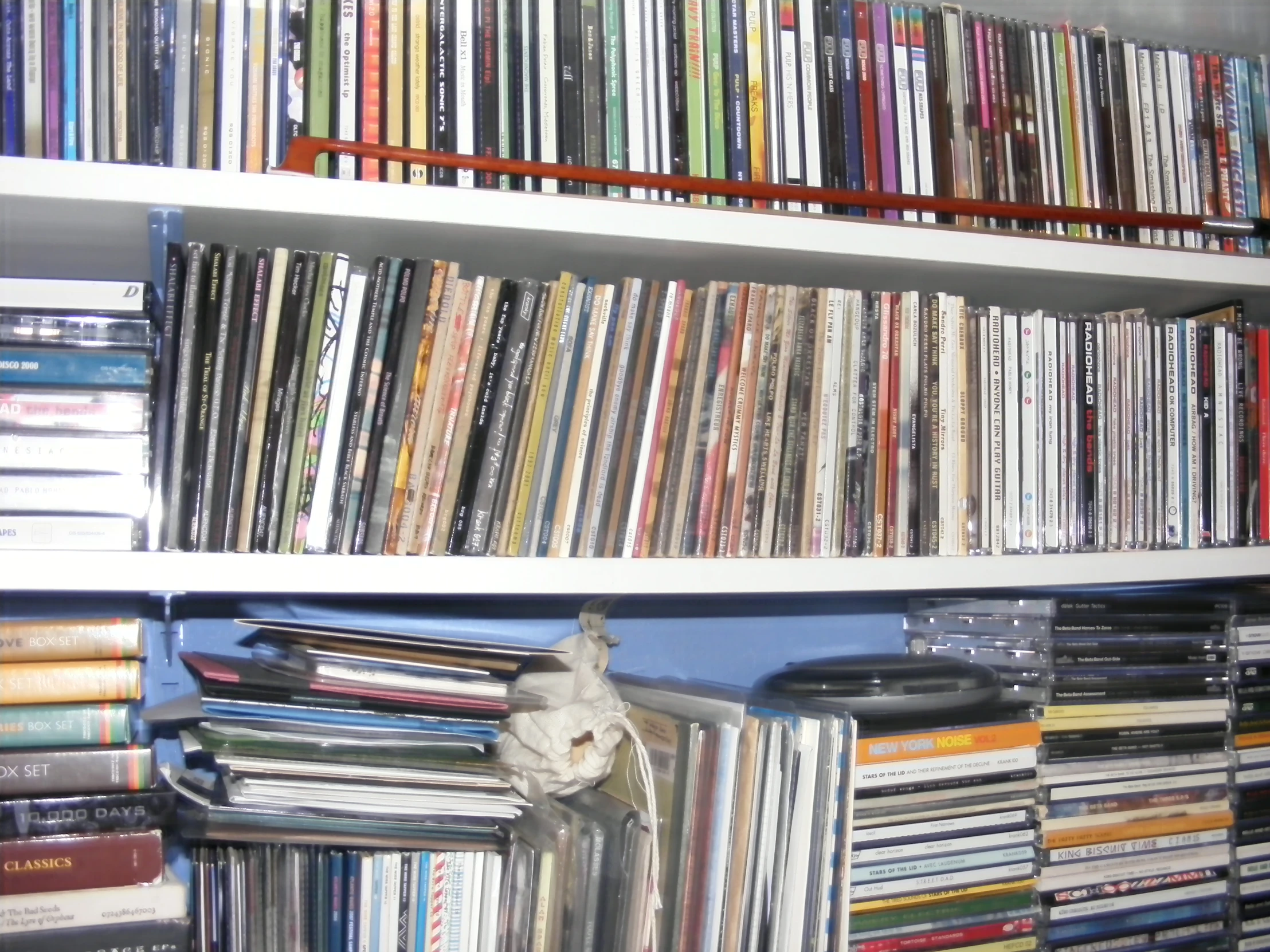 several shelves filled with various types of audio equipment