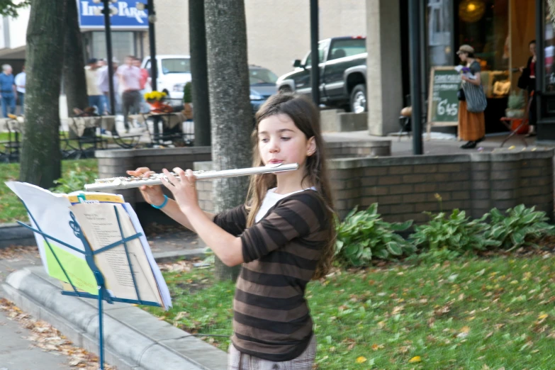  playing a flute on a street corner