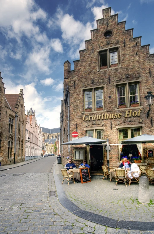 a cobblestone street lined with old buildings