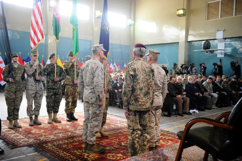 soldiers holding flags and standing with american and canadian flags