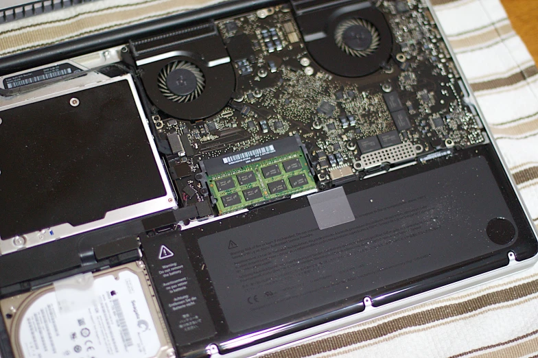 an old laptop is removed and ready to be cleaned