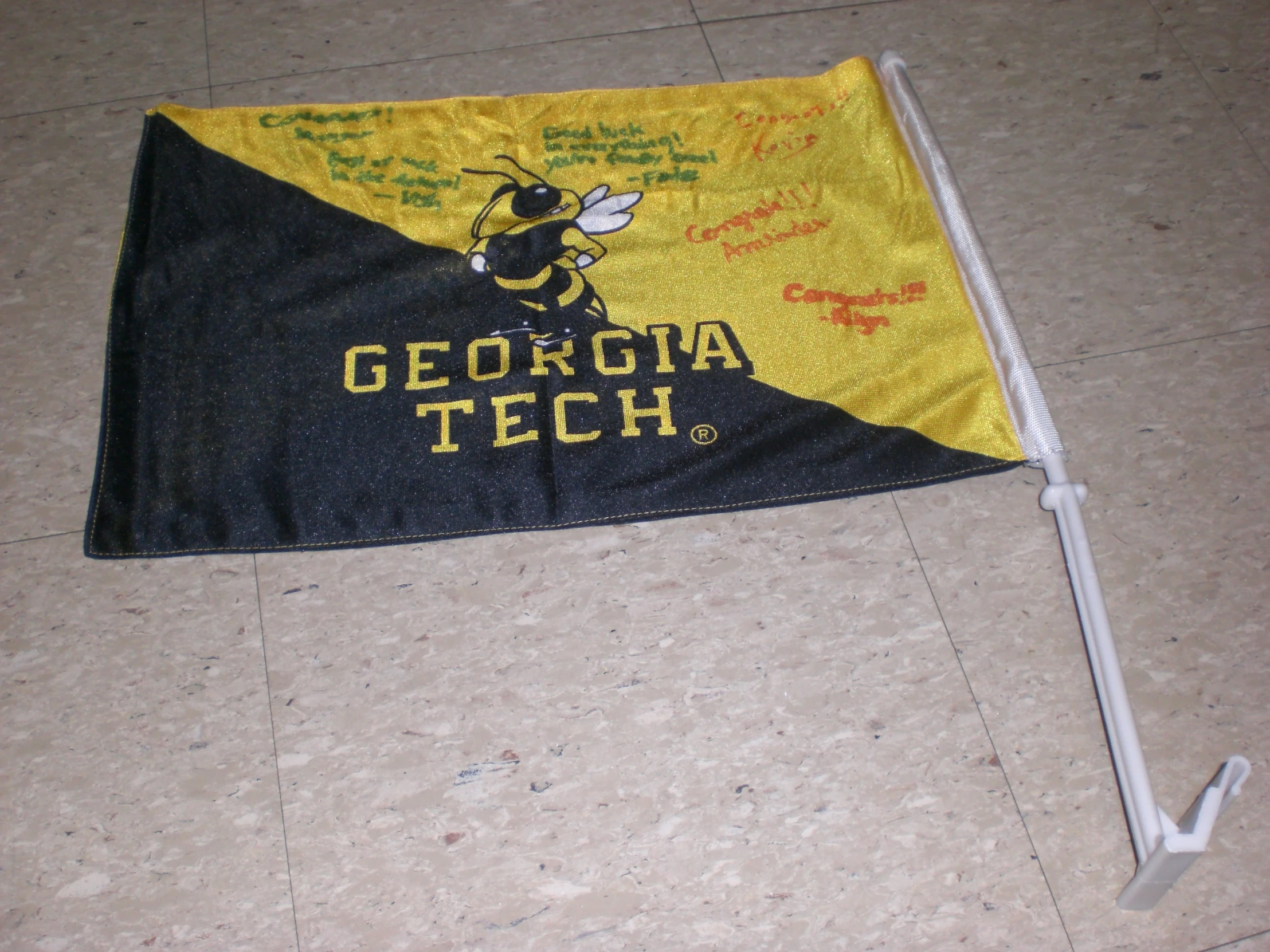 an old style geokoja tech flag is placed on the ground