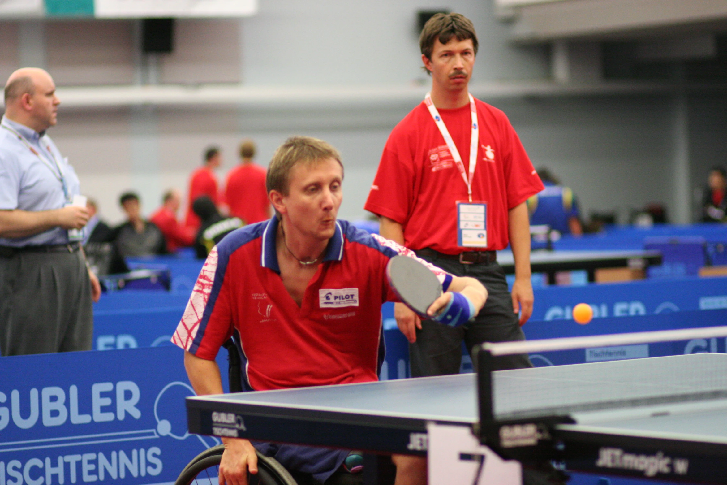 an image of two men on a table tennis match