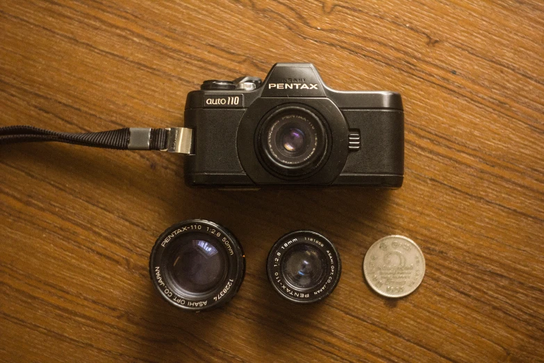 a camera and several small pieces of metal on a table