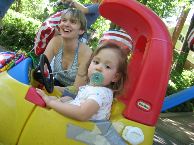 two s in a toy train with water