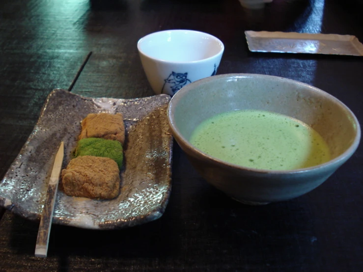 some food and a cup on a table