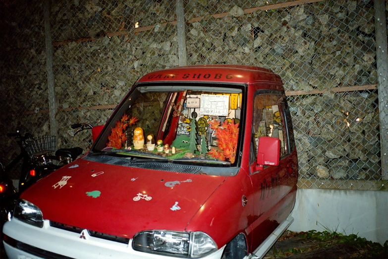 a red van with decorations on the back of it