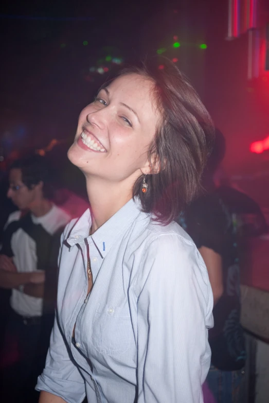 a lady with a funny smile at a party