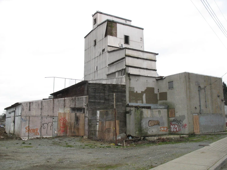 the abandoned building is covered in graffiti