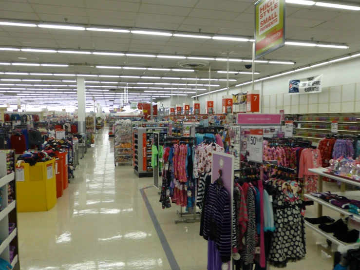 an indoor area has many rows of items on display for sale