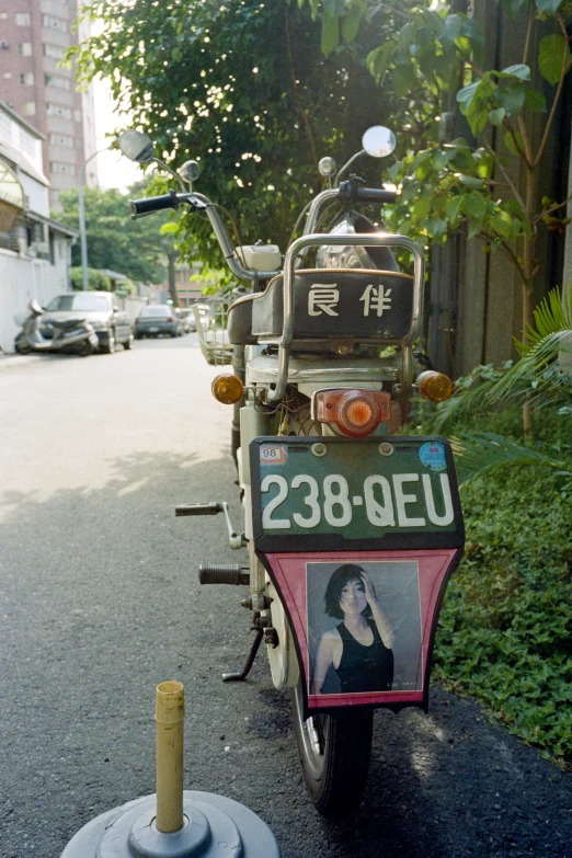 a bicycle is parked along a street with the word 1932 - eu on it