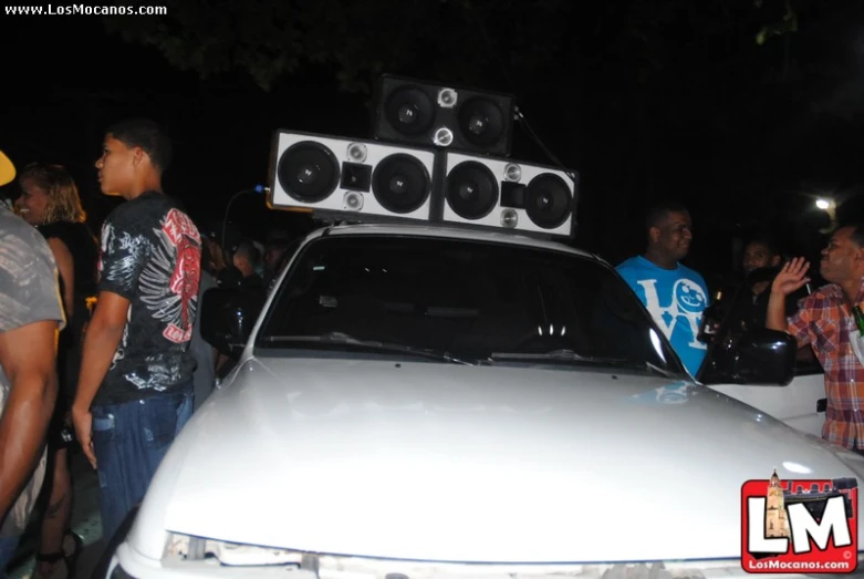 a car with sound system and speakers on top