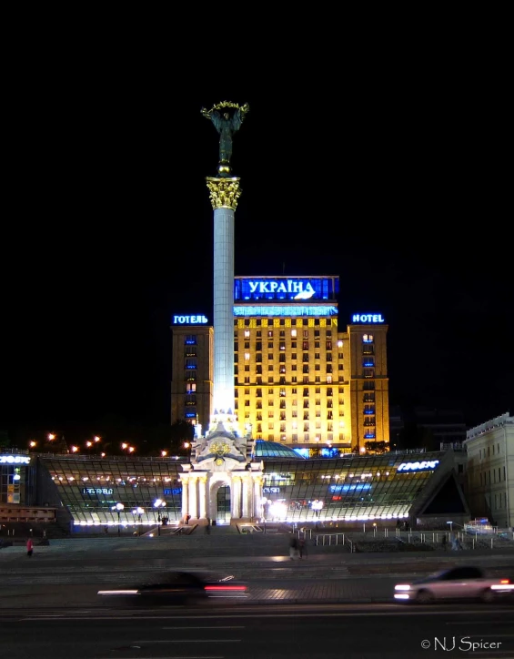 a very tall building with a large blue sign on it