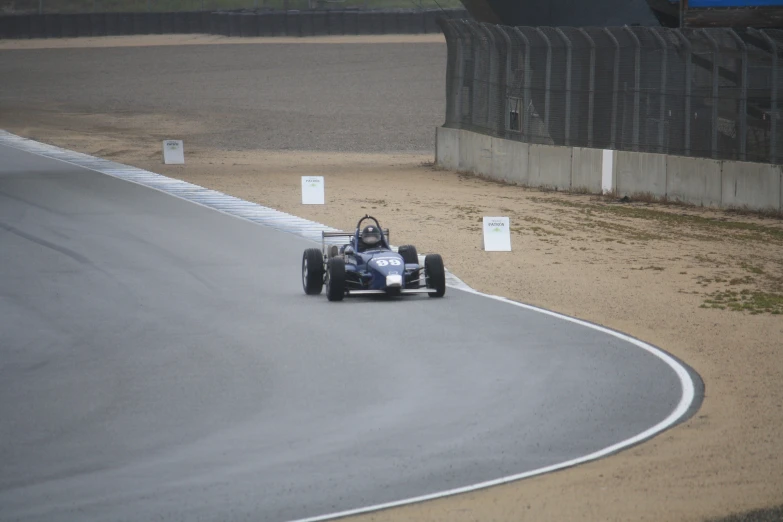 a racer car on a winding road at a race