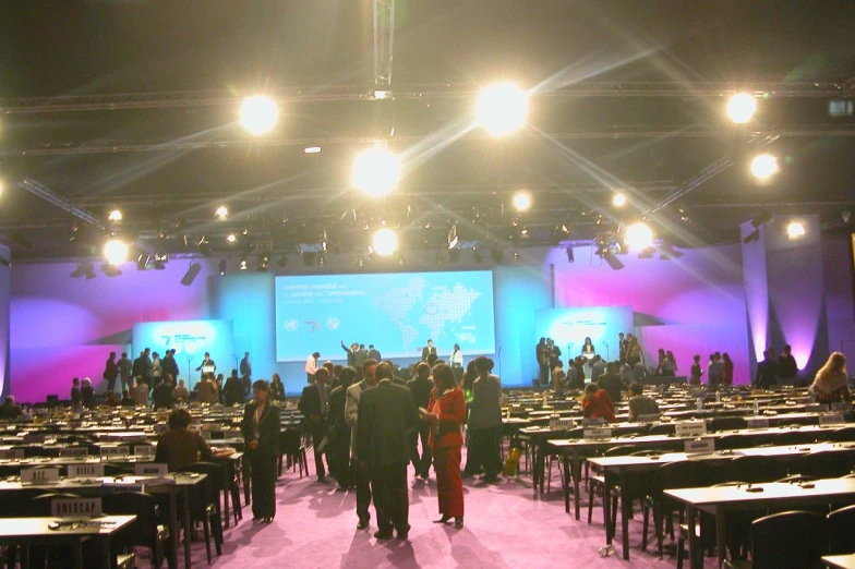 a large conference hall with many people