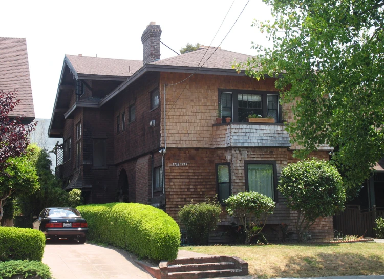 a house with a car parked on the street