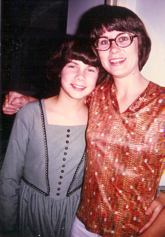 two young women pose for the camera