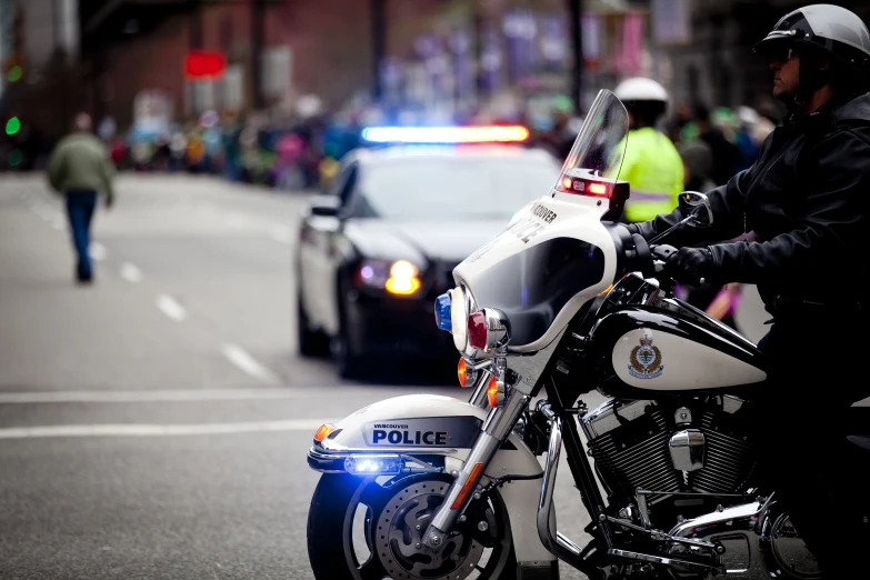 police officer on motorcycle in city at night