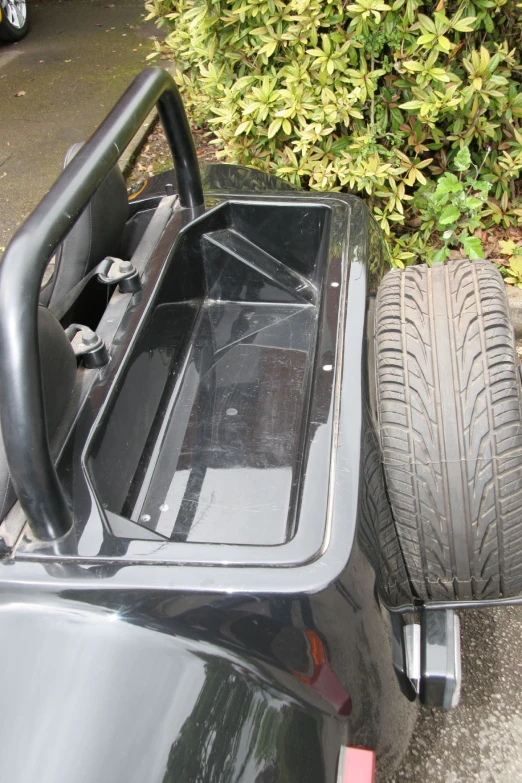 car with side storage area sitting in dirt