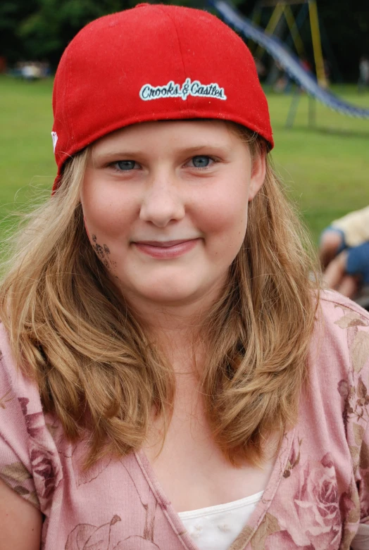 a close up of a person with a hat on